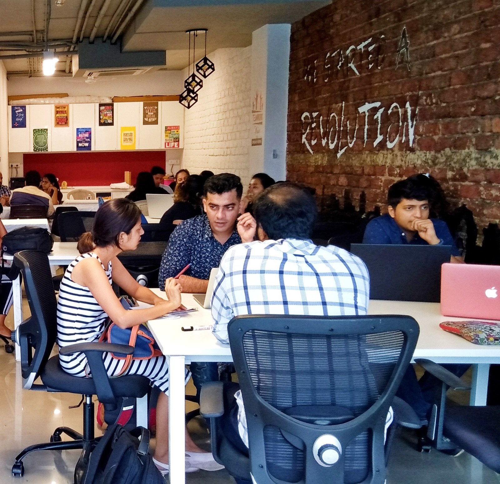 Members collaborating at dedicated desks